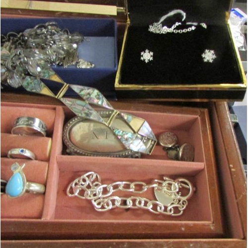 530R - A jewellery box and contents to include pendants, bracelets, rings etc.,