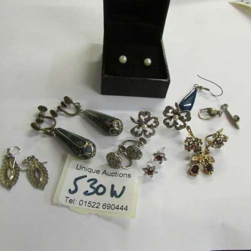 530W - 7 pairs of earrings and 3 odd earrings.