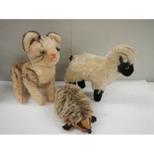 773 - A Staffordshire hedgehog, goat and cat,.