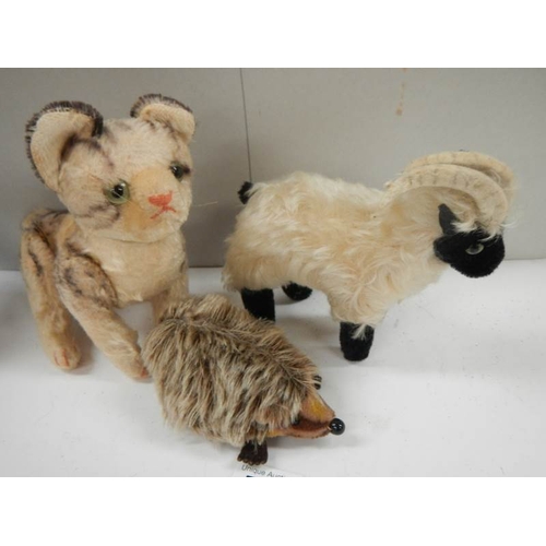 773 - A Staffordshire hedgehog, goat and cat,.