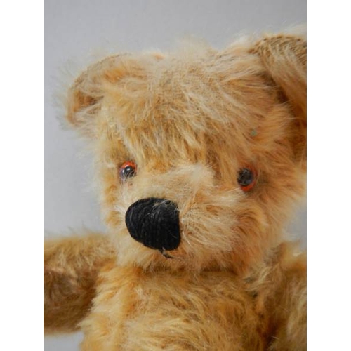 778 - An old straw filled Teddy bear, 12'' tall, in good order.