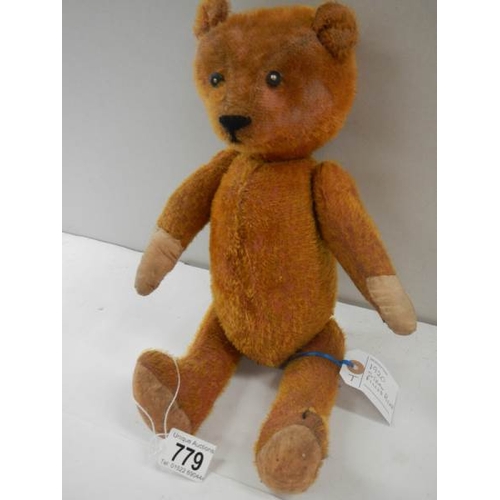 779 - A straw filled Teddy bear, 15'' long, in fair condition.