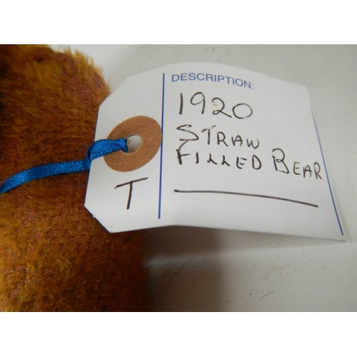 779 - A straw filled Teddy bear, 15'' long, in fair condition.