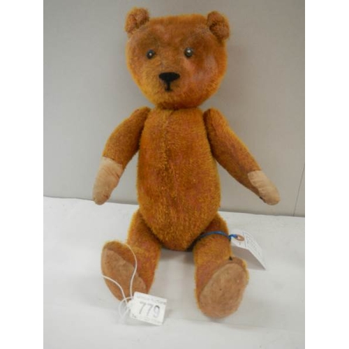 779 - A straw filled Teddy bear, 15'' long, in fair condition.