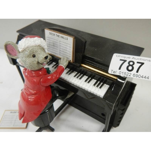 787 - A battery operated mouse playing a piano with 7 tune sheets that are inserted in the back for him to... 