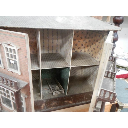 793 - A Victorian style dolls house, 31'' x 26''