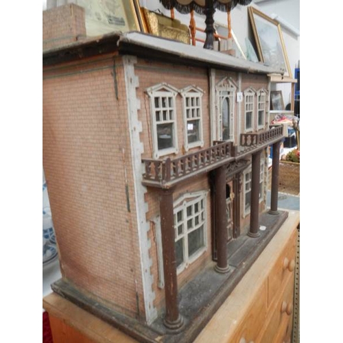 793 - A Victorian style dolls house, 31'' x 26''