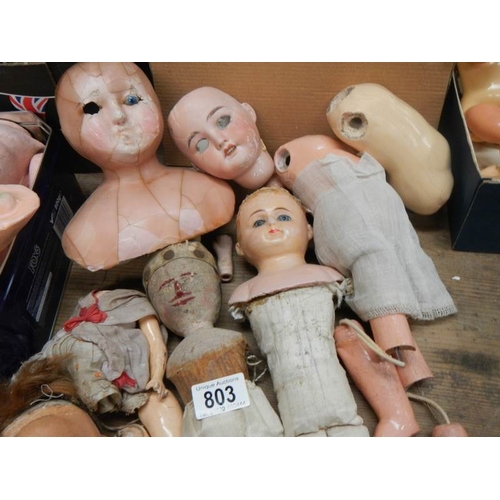 803 - A large mixed lot of doll parts including arms, legs. torsos etc.,