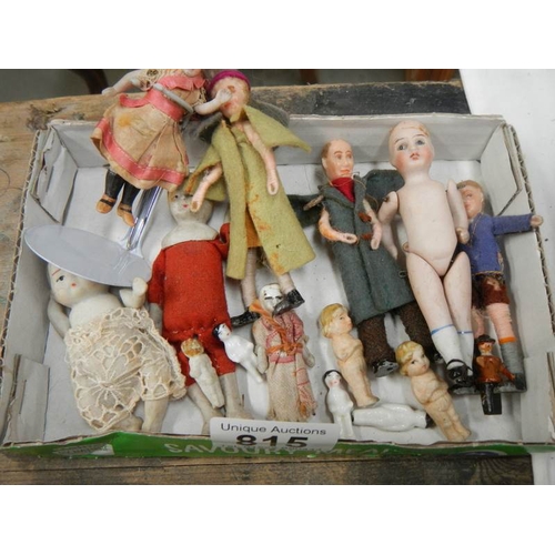 815 - A tray of small porcelain dolls etc,,