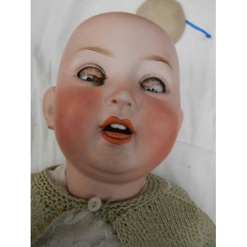 817 - A Victorian dressed porcelain doll, needs wig, 30'' tall.