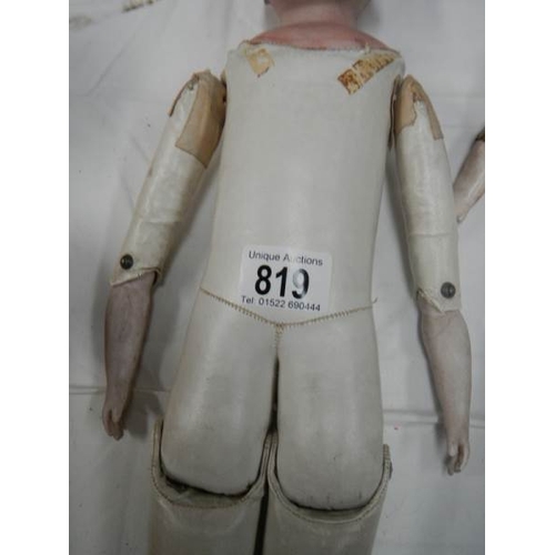 819 - A Victorian porcelain headed doll with kid body, needs wig, 20'' tall.