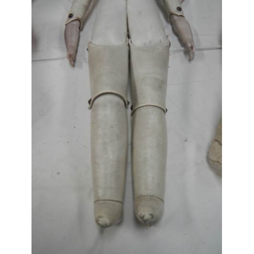 819 - A Victorian porcelain headed doll with kid body, needs wig, 20'' tall.