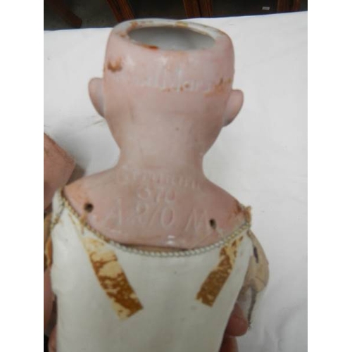 819 - A Victorian porcelain headed doll with kid body, needs wig, 20'' tall.