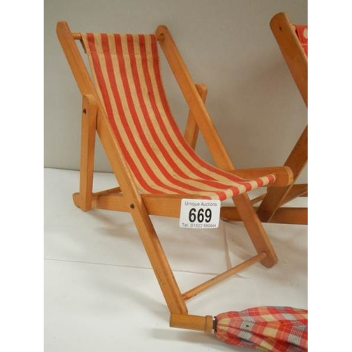 669 - 2 dolls deck chairs and parasol;