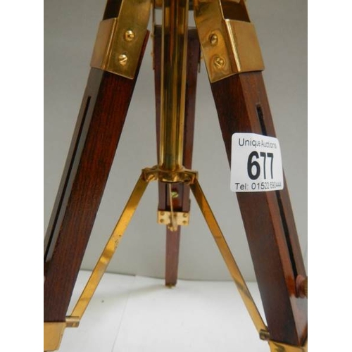 677 - A 20th century brass telescope on adjustable stand, height 15''.