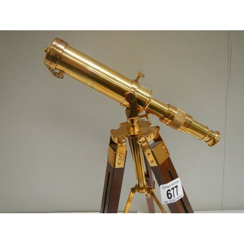 677 - A 20th century brass telescope on adjustable stand, height 15''.