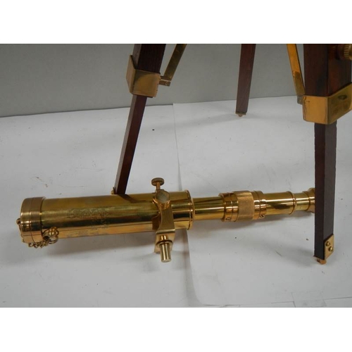 677 - A 20th century brass telescope on adjustable stand, height 15''.