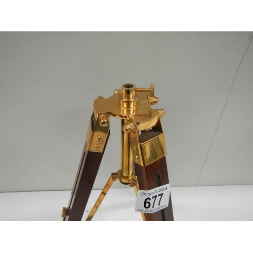 677 - A 20th century brass telescope on adjustable stand, height 15''.