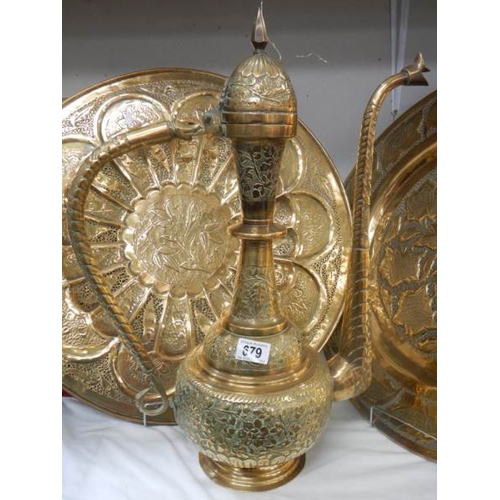 679 - 2 large brass plates and a 22'' tall brass jug.