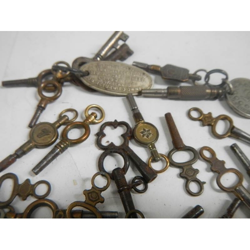 681 - A large lot of late 19th / early 20th century pocket watch keys (approximately 37).