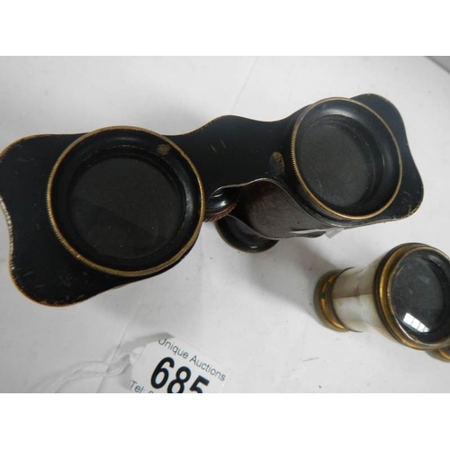 685 - 2 pairs of vintage opera glasses, one mother of pearl and the other brass with leather covering.