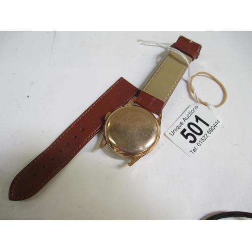 501 - A fine Dogma Prima wrist watch with 18ct gold back and calf strap, in full working order.