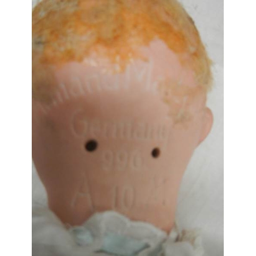 840 - A Victorian porcelain headed doll, missing wig, 18''.