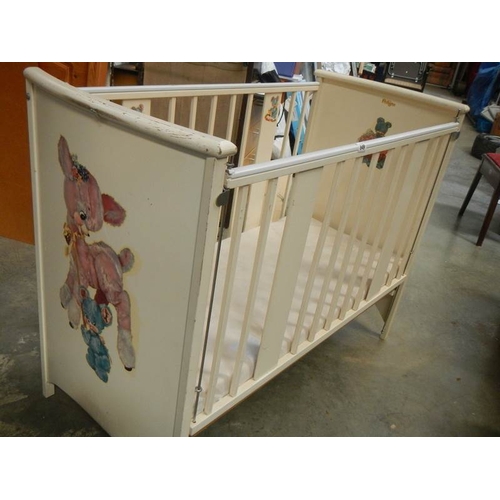 849 - An old painted babies cot.