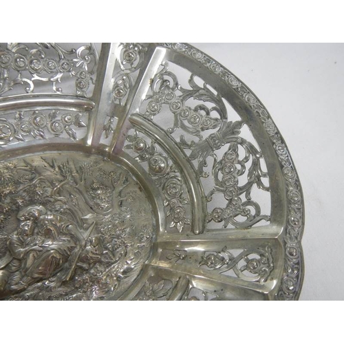 2014 - A foreign silver embossed dish, approximately 308 grams.