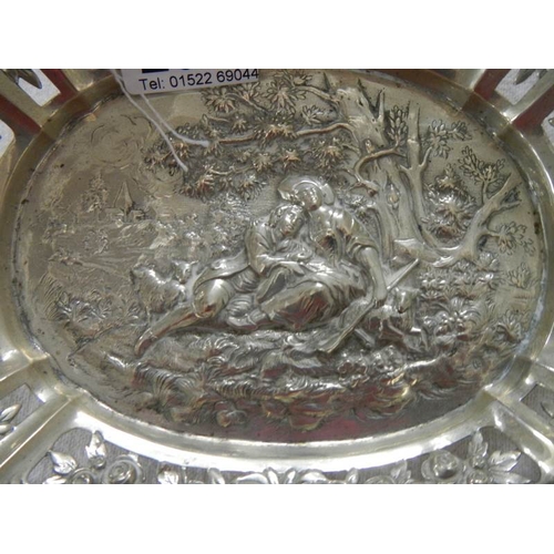 2014 - A foreign silver embossed dish, approximately 308 grams.