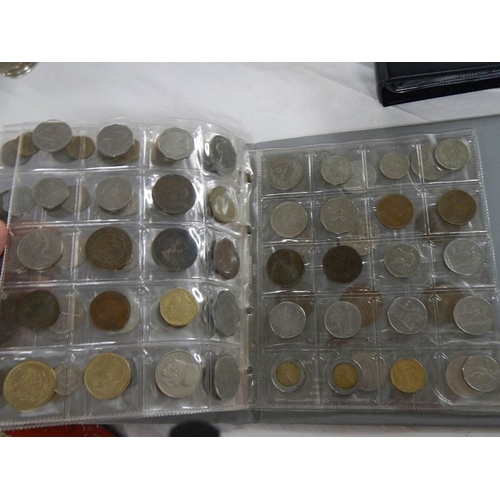 2023 - 2 albums of in excess of 250 foreign coins.