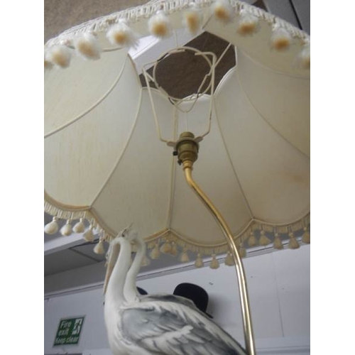 2103 - A good quality mid - late 20th century Capodimonte table lamp being figures of storks, 31'' tall a/f