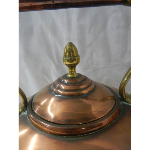 2110 - A Victorian copper kettle with bronze handle.