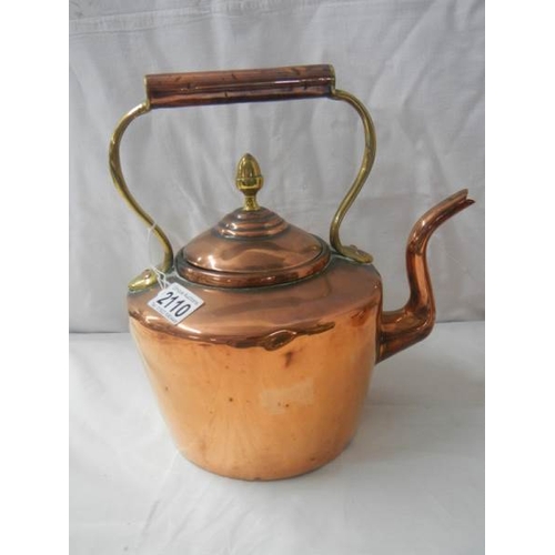 2110 - A Victorian copper kettle with bronze handle.