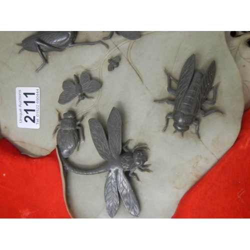 2111 - An early 20th century carved soapstone leaf with carved soapstone insects on top, 14.5'' x 13''.