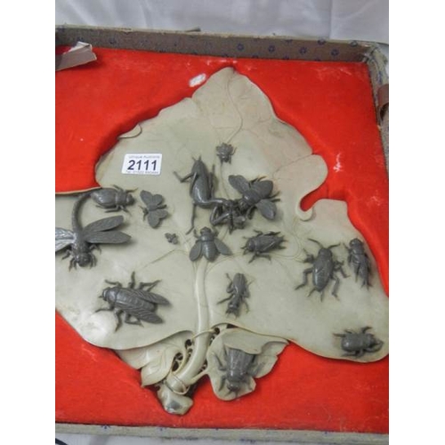 2111 - An early 20th century carved soapstone leaf with carved soapstone insects on top, 14.5'' x 13''.