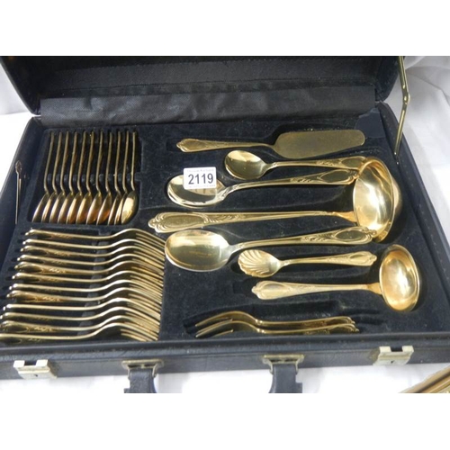 2119 - A gilded 12 place setting cutlery set by Besteoke Solingen, Germany.