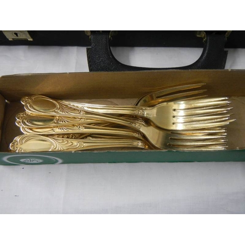 2119 - A gilded 12 place setting cutlery set by Besteoke Solingen, Germany.