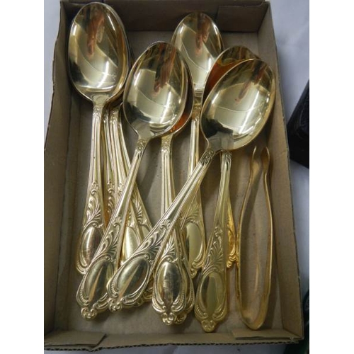 2119 - A gilded 12 place setting cutlery set by Besteoke Solingen, Germany.