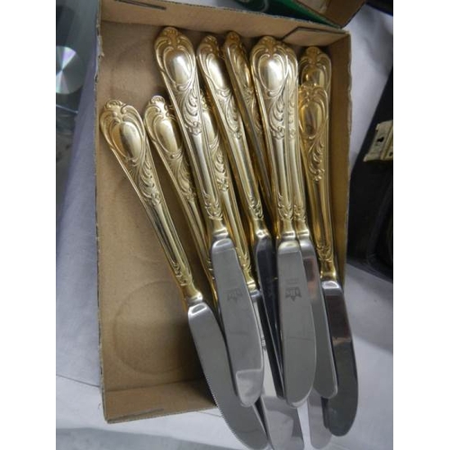 2119 - A gilded 12 place setting cutlery set by Besteoke Solingen, Germany.