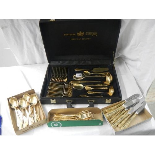 2119 - A gilded 12 place setting cutlery set by Besteoke Solingen, Germany.