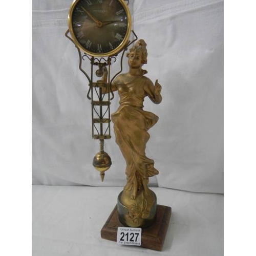 2127 - A Victorian swinging lady clock.