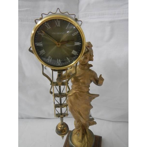 2127 - A Victorian swinging lady clock.