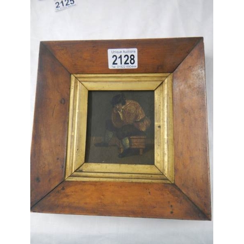 2128 - A Victorian oil on board in maple frame.