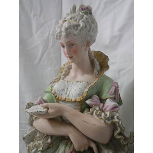 2138 - A tall bisque figure of a lady, 25'' tall, a/f see images.