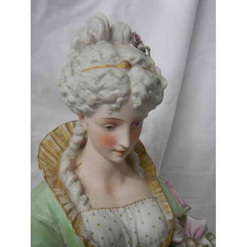 2138 - A tall bisque figure of a lady, 25'' tall, a/f see images.