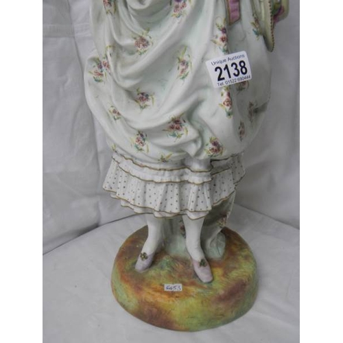 2138 - A tall bisque figure of a lady, 25'' tall, a/f see images.