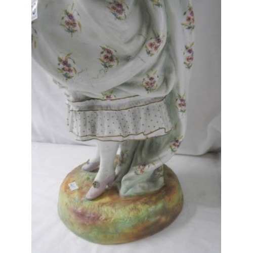 2138 - A tall bisque figure of a lady, 25'' tall, a/f see images.