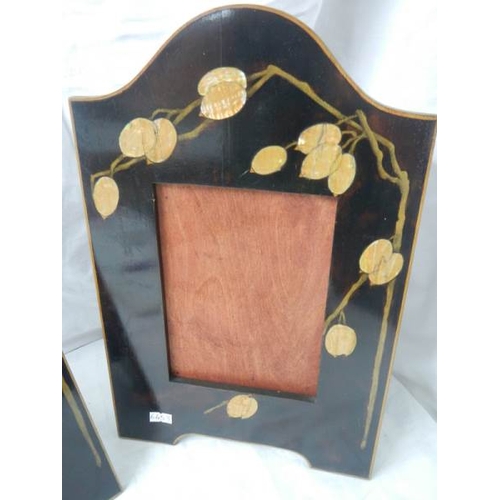 2141 - A pair of art deco inlaid photo frames, 10'' x 16''.