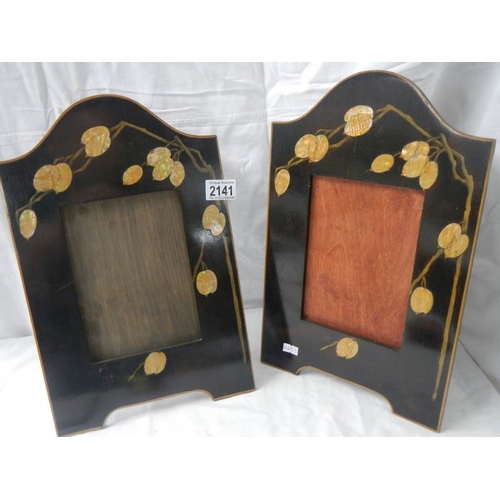 2141 - A pair of art deco inlaid photo frames, 10'' x 16''.